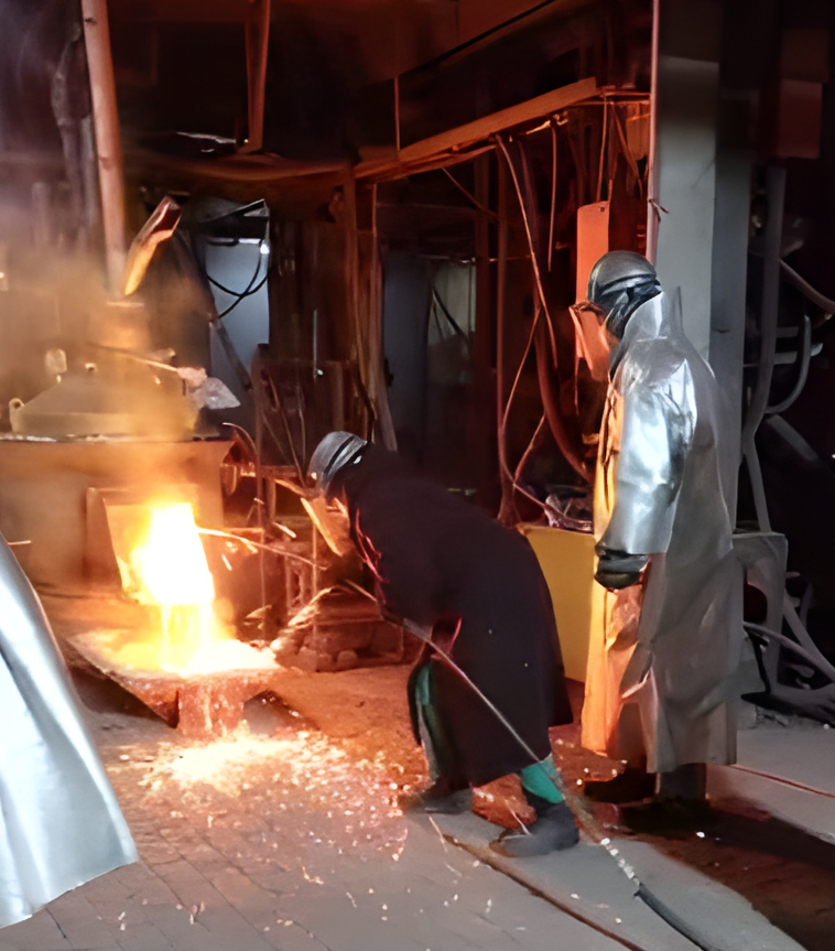 Female operator tapping the 200 kW furnace at Mintek, South Africa